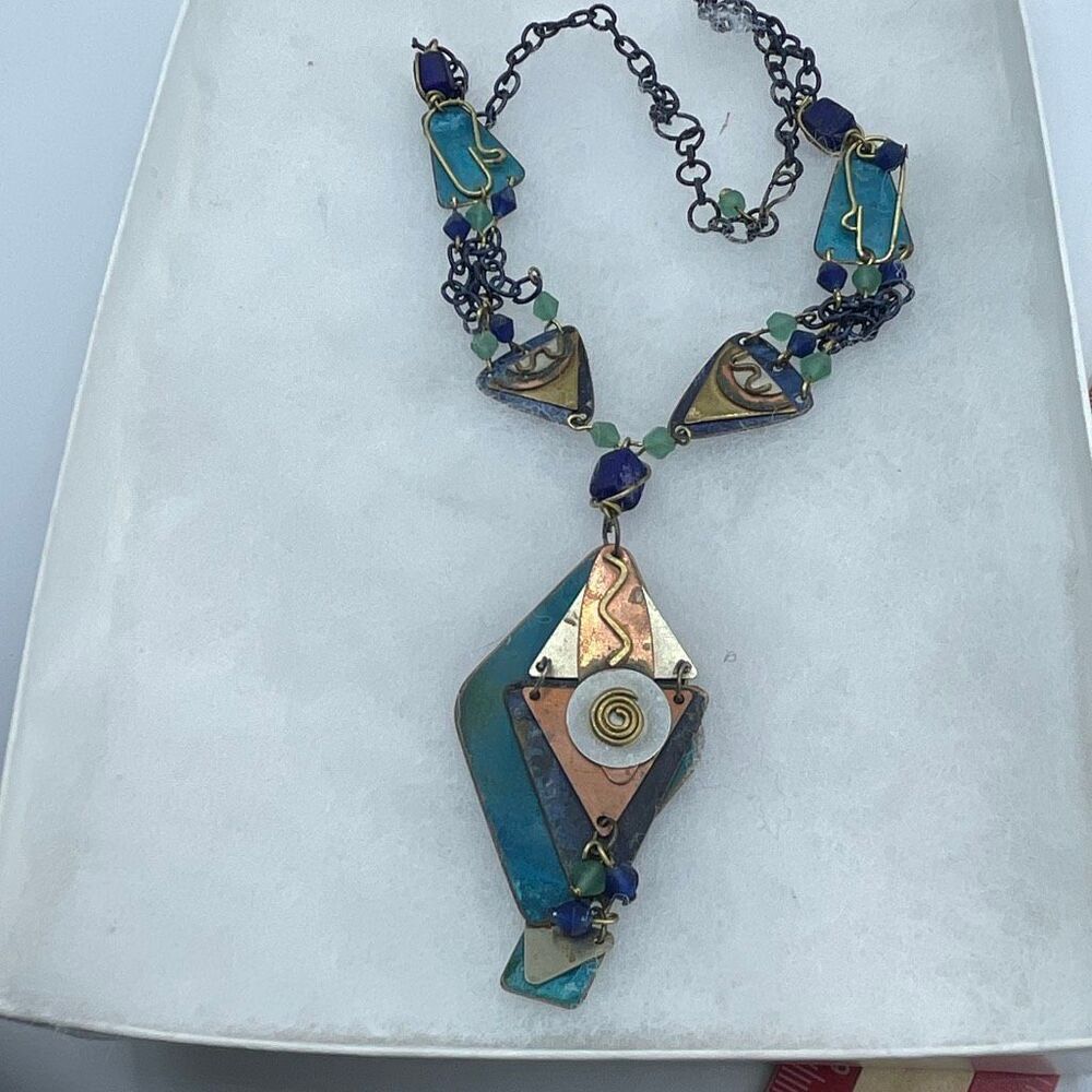 Bohemian mixed metals steam punk decor pendant necklace.